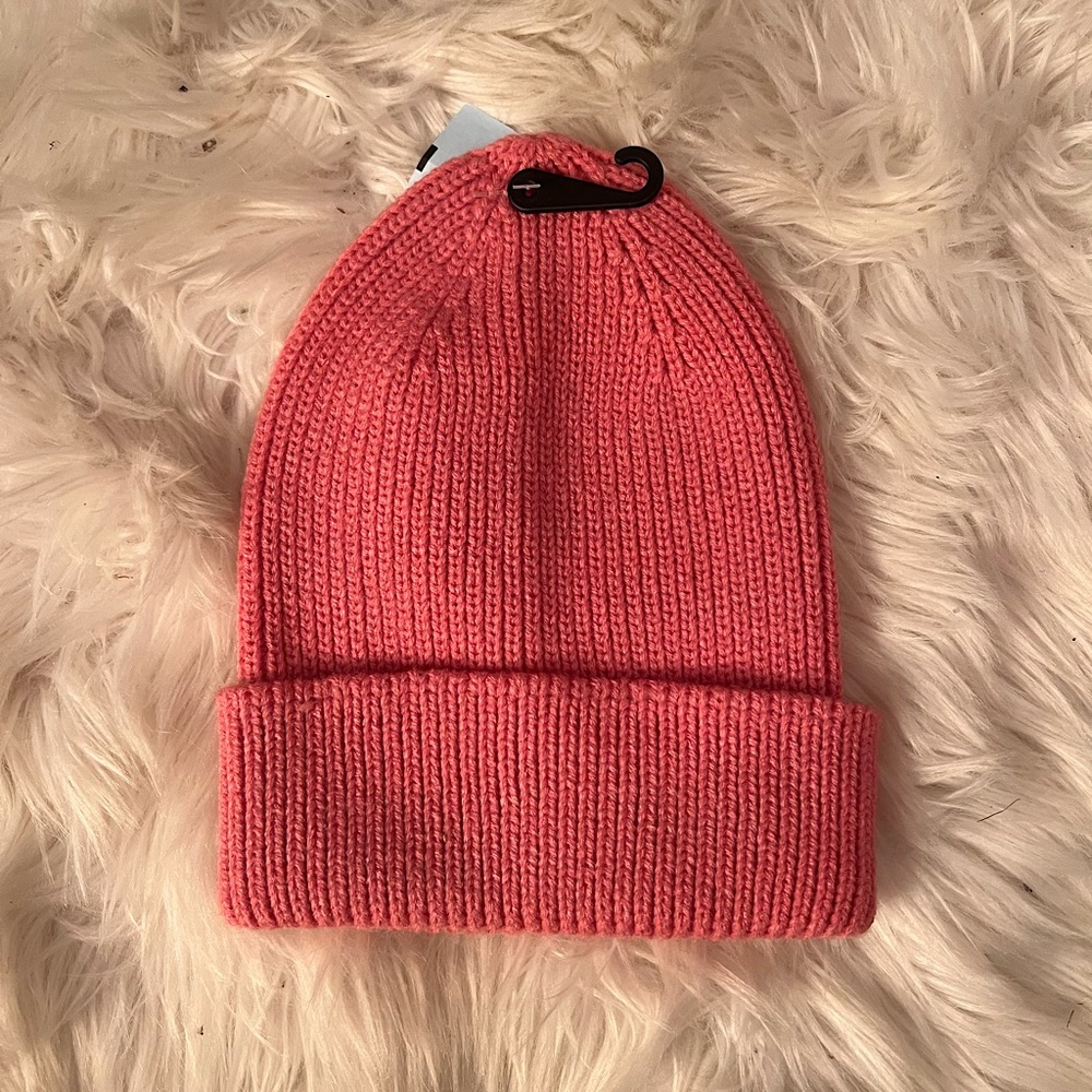 Pink knit beanie hat